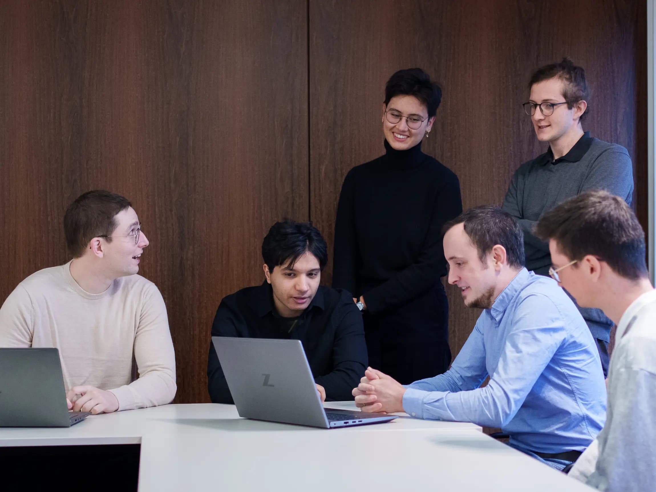 people looking at the same laptop in the trustID set up